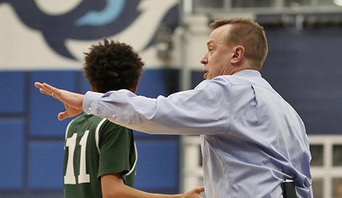 Basketball coach on sidelines.